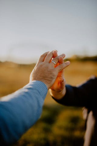 Two people touching hands