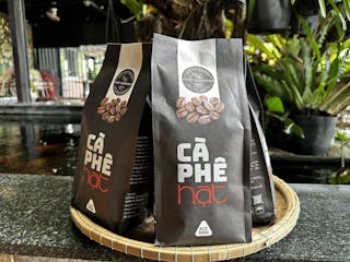 Whole roasted coffee beans packaged