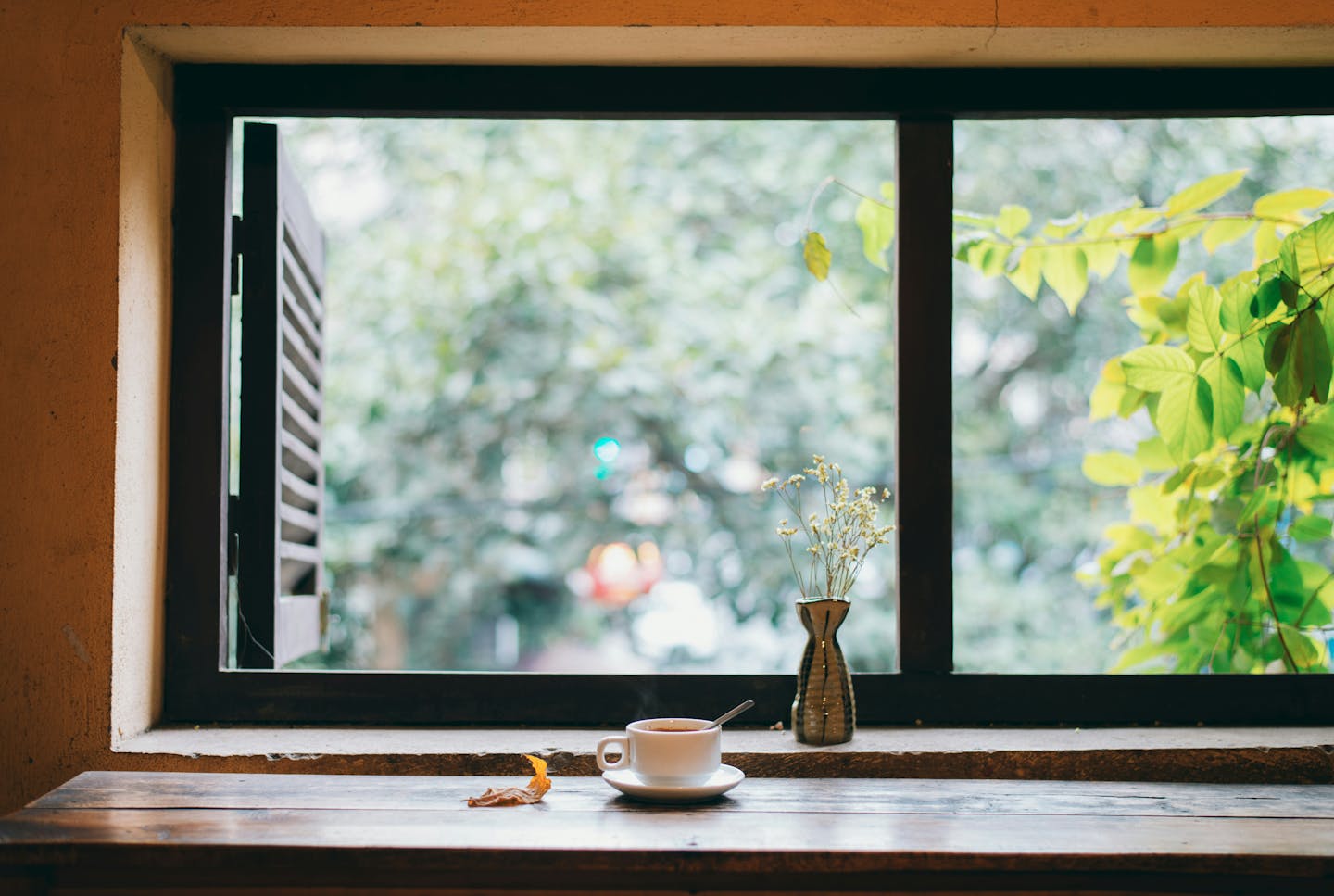 Cup of coffee on brown wooden table